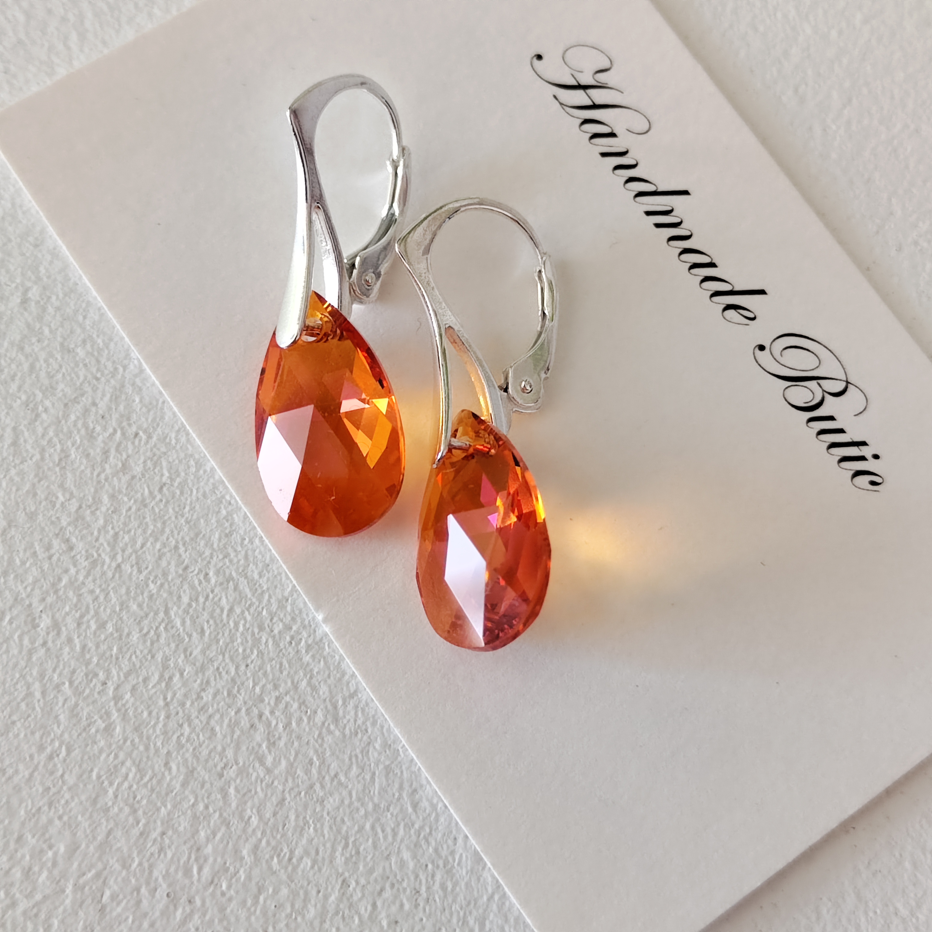 cercei portocalii swarovski